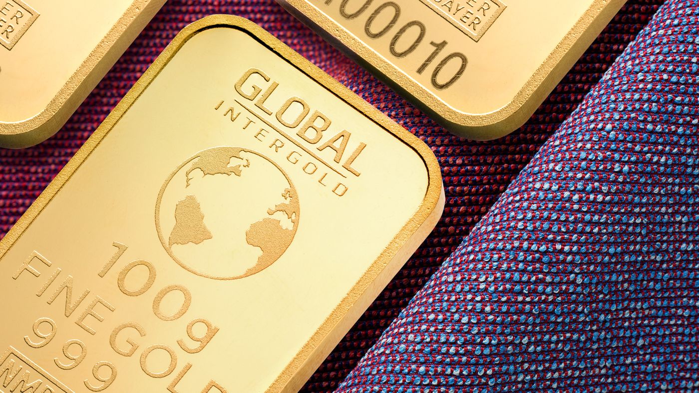 Close-up of refined gold bars stamped with purity marks